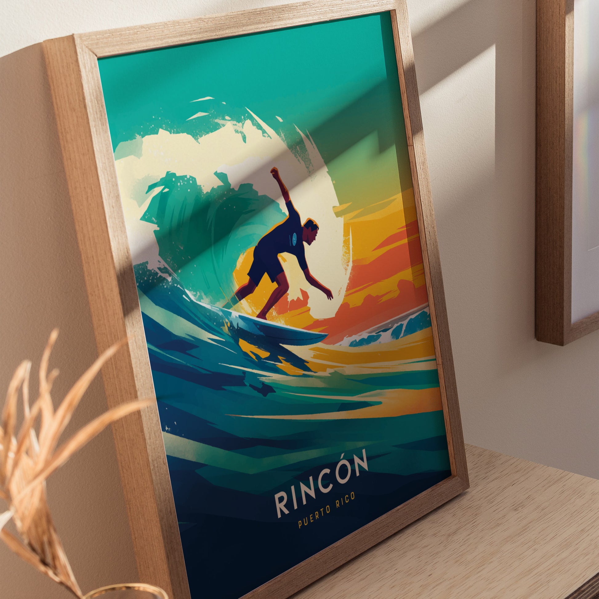 A framed poster features a vibrant illustration of a surfer riding a wave against a colorful sunset, with the text Rincon Puerto Rico at the bottom.