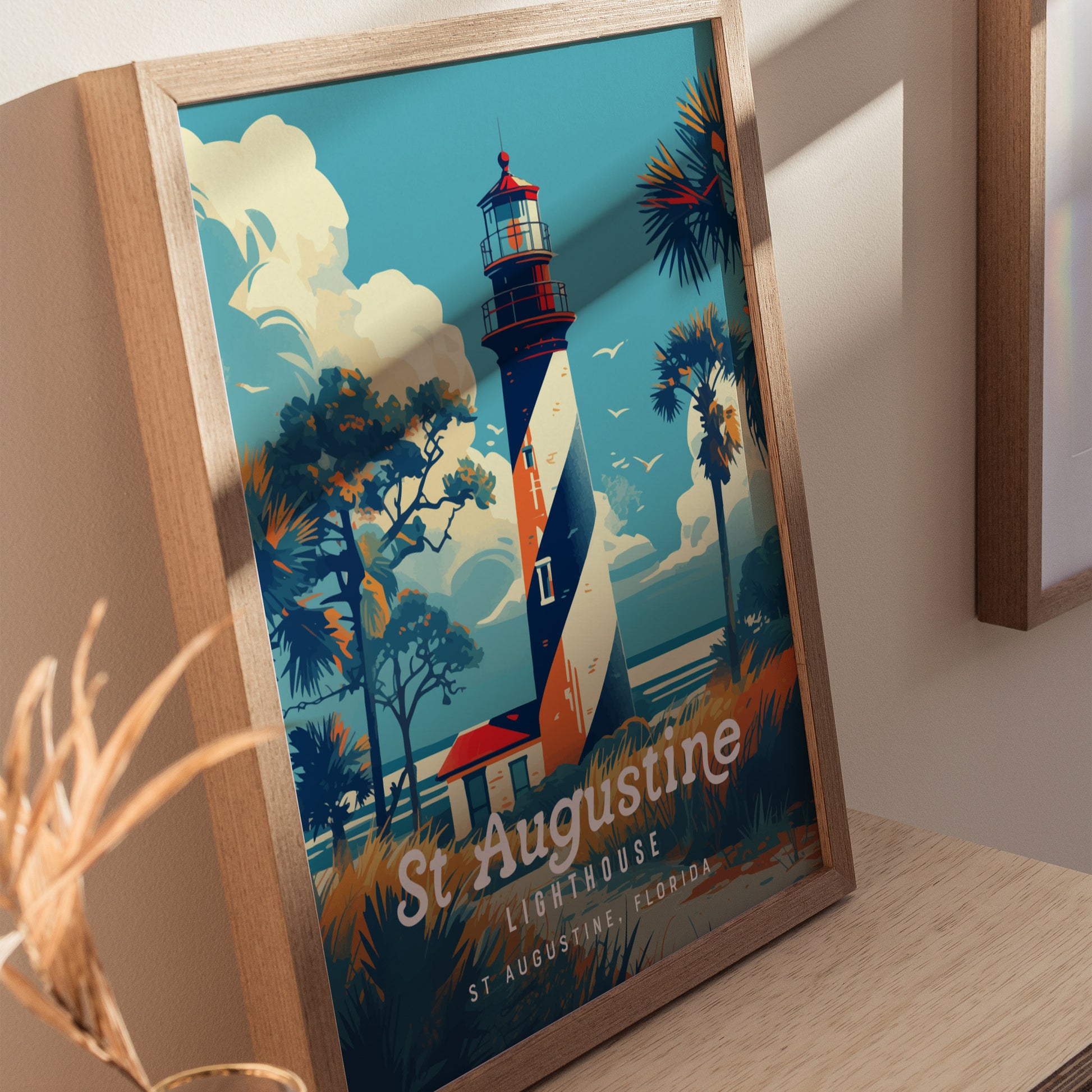 A framed poster features a vintage-style illustration of the St. Augustine Lighthouse with its iconic black and white spiral design. The scene includes palm trees, clouds, and birds, capturing a coastal Florida vibe.