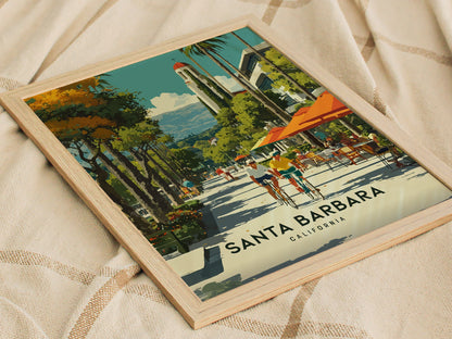 Framed artwork of Santa Barbara, California with a lighthouse and beach scene.