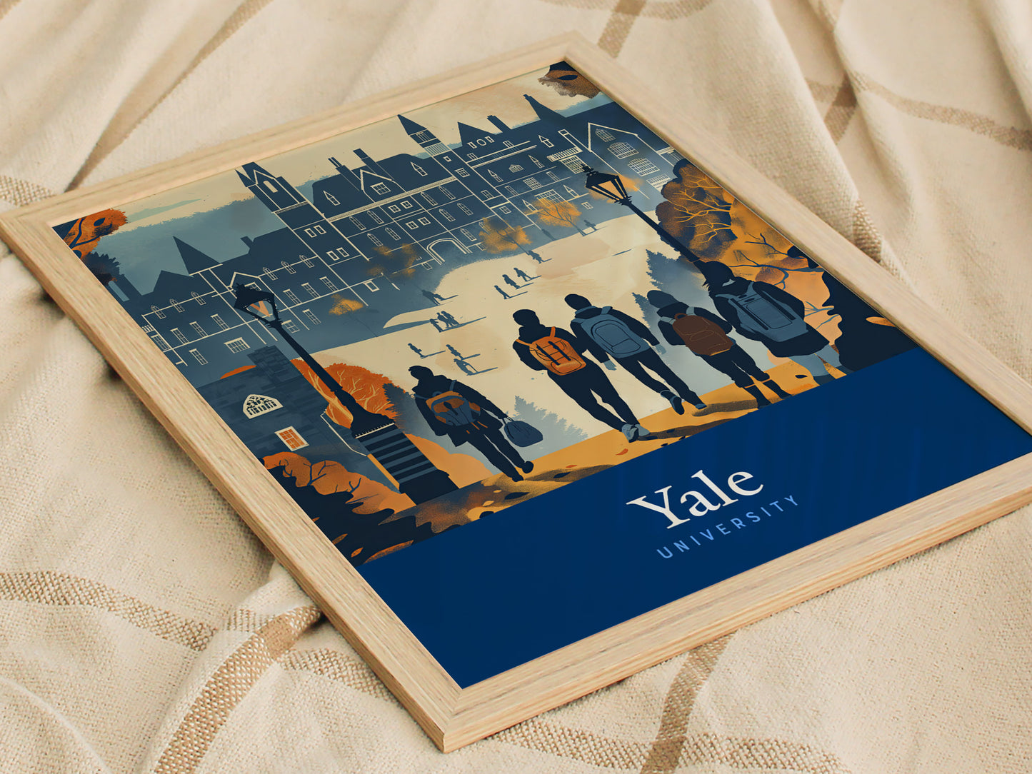 A framed poster depicting Yale University in a minimal vector style shows students walking towards iconic Gothic architecture, set against a backdrop of autumnal colors.