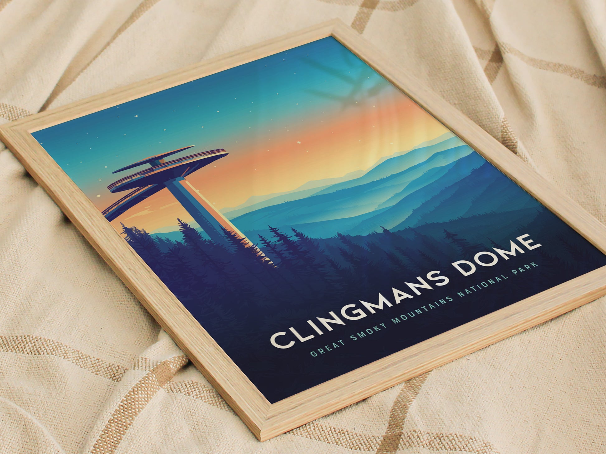 A framed poster of Clingmans Dome showcases an illustration of the observation tower against a vibrant sunset sky, with layers of blue mountains and evergreen trees. Text reads Clingmans Dome, Great Smoky Mountains National Park.