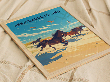 Framed Assateague Island poster featuring wild horses running along a beach with a vibrant sky and seagulls, placed on a soft, textured fabric.