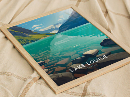 Framed poster of Lake Louise, Canada, depicting turquoise waters and mountains, resting on a beige fabric background. The artwork captures the serene beauty of Banff National Park.