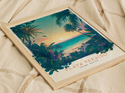 A framed poster depicting a tropical beach scene with lush greenery, palm trees, and a vibrant sunset over turquoise waters, labeled Playa Paraíso, Tulum, Mexico, resting on a textured fabric.