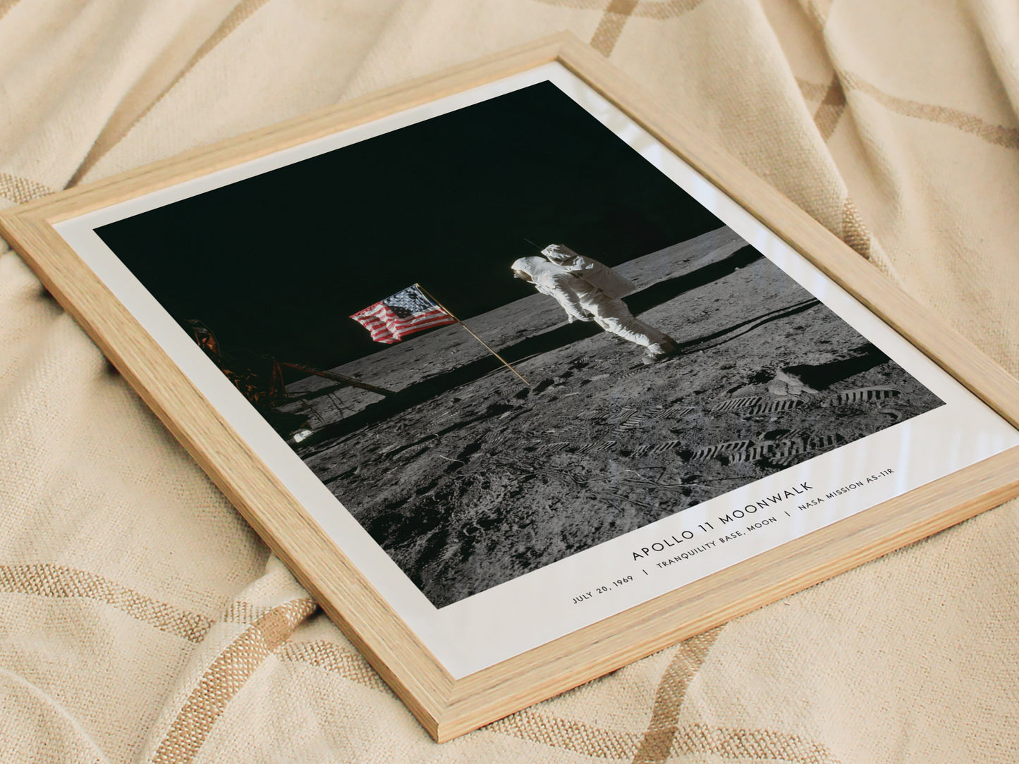 Close detail of astronaut suit footprints and American flag in NASA photo AS11-40-5874