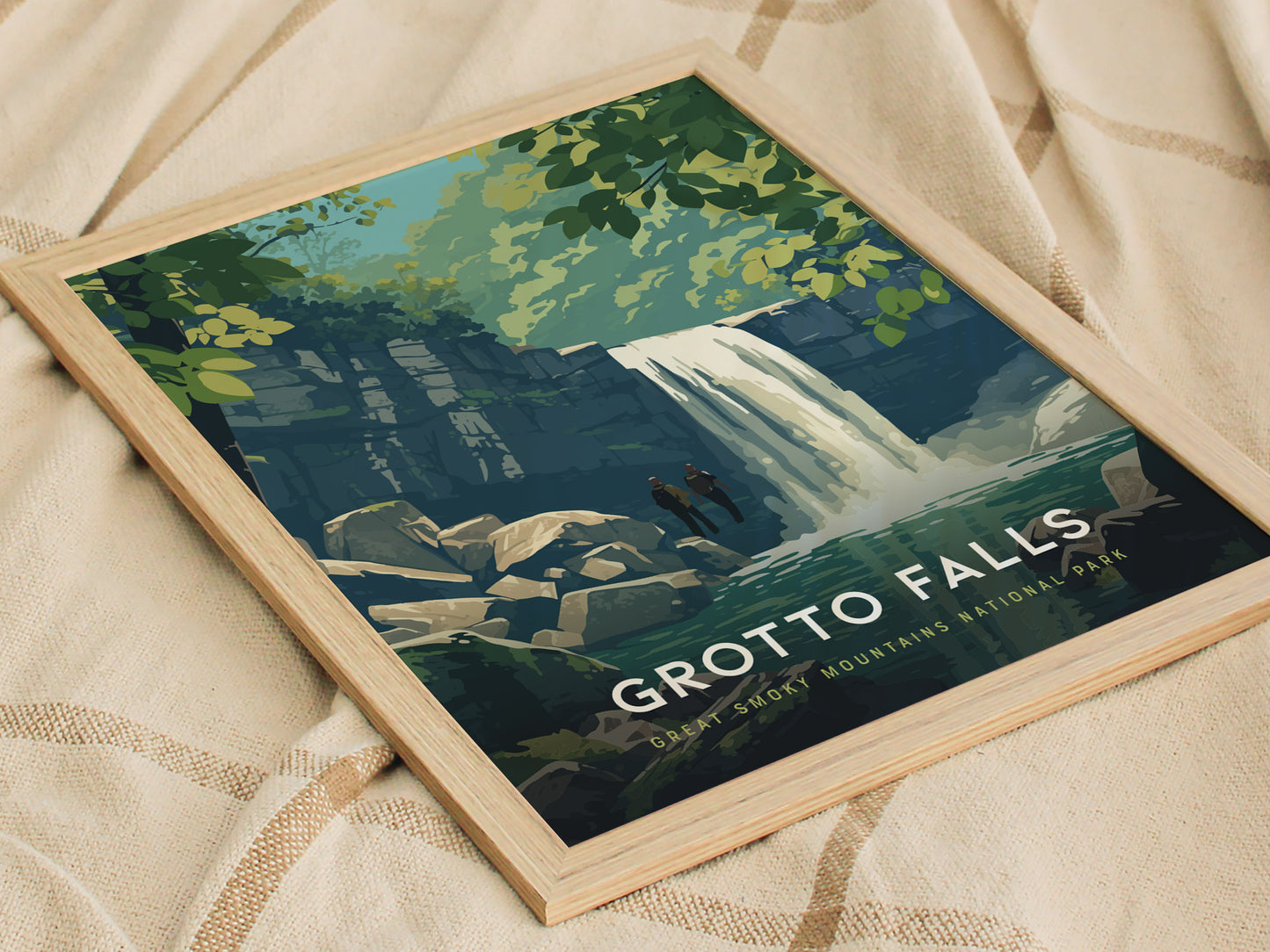A framed poster depicting Grotto Falls in the Great Smoky Mountains, featuring a waterfall cascading into a serene pool surrounded by lush greenery and rocks. The text reads Grotto Falls, Great Smoky Mountains National Park.