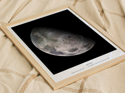 Framed print of the moon on a textured fabric background
