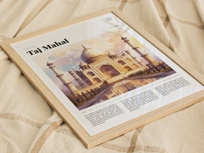 A framed poster features a watercolor illustration of the Taj Mahal with accompanying text, set against a textured beige fabric backdrop. The design captures the monuments intricate beauty.