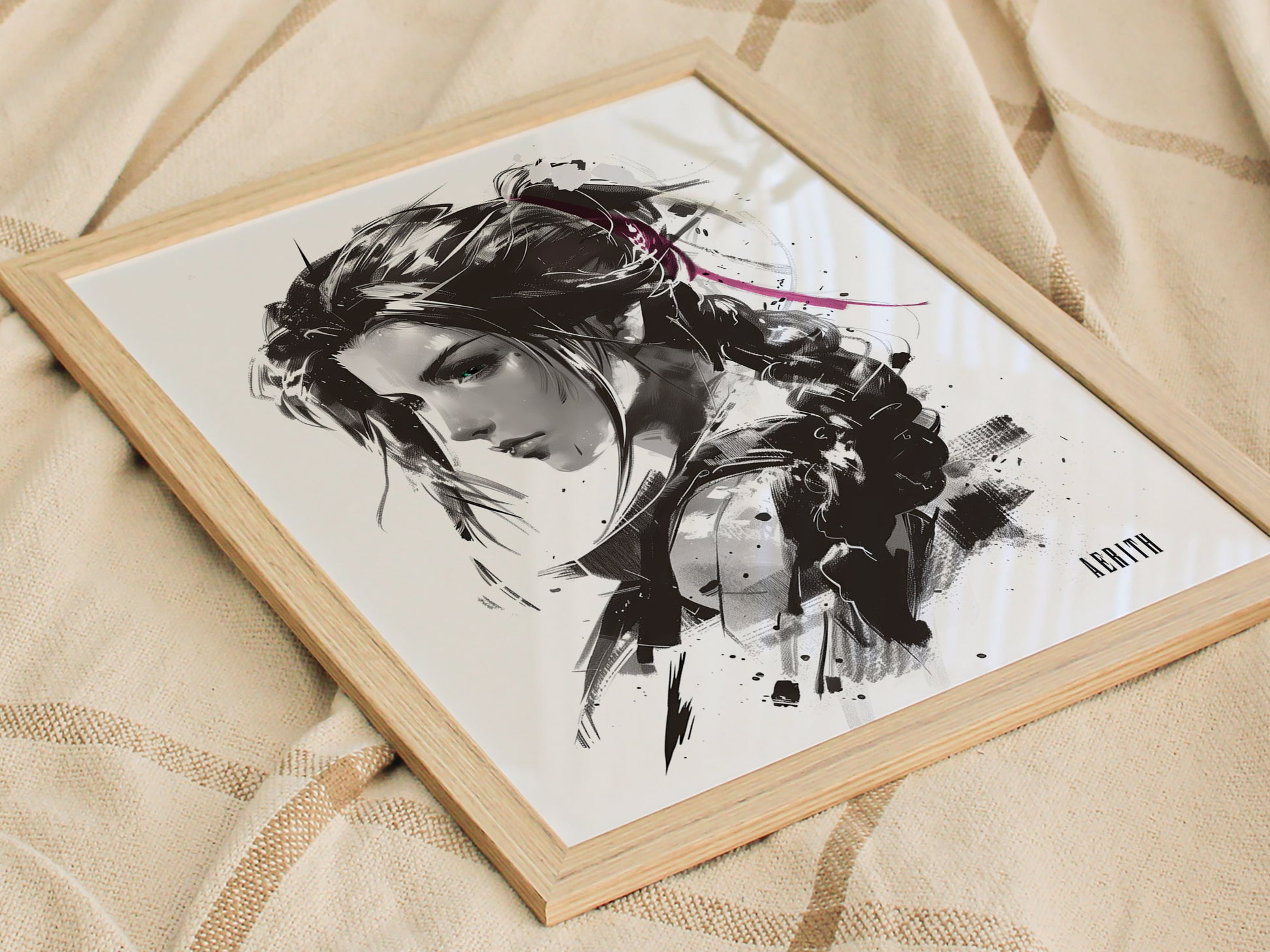 A monochrome portrait of a woman with flowing hair, styled with expressive ink strokes, framed in light wood and resting on a textured fabric surface.