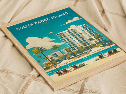 Framed South Padre Island poster featuring a coastal scene with palm trees, a modern hotel, and beach loungers under a clear blue sky, placed on a textured beige fabric.