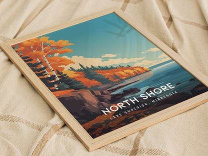 A framed poster titled North Shore, Lake Superior, Minnesota showcases a vibrant landscape with autumn-colored trees, rocky shores, and a serene lake under a blue sky. The artwork captures the rugged beauty of Minnesotas coastline.