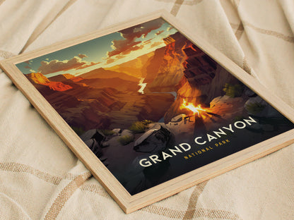 A framed poster of the Grand Canyon features a vibrant sunset over layered rock formations, with the text Grand Canyon National Park visible. The poster rests on a beige fabric.