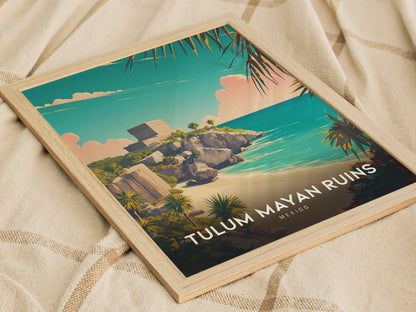 A framed poster of Tulum Mayan Ruins with a vibrant illustration of the temple overlooking turquoise waters and lush greenery, resting on a textured fabric background.