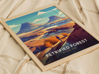 A framed art print of Petrified Forest National Park featuring vibrant desert landscapes with mesas and colorful rock formations, resting on a textured beige fabric.