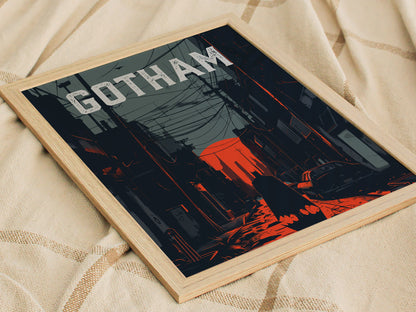 A framed poster features a noir-style depiction of Gotham City, with bold red and deep gray tones. The word GOTHAM is prominently displayed at the top, above a shadowy street scene with power lines and a silhouette of a figure.
