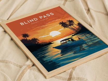 A framed poster titled Blind Pass Sanibel, Florida depicts a vibrant sunset over water with a boat and palm trees, set against an orange sky on a textured fabric background.