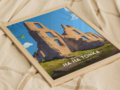 Framed artwork depicting the ruins of Ha Ha Tonka State Park in Missouri, showcasing stone structures against a clear blue sky. The poster rests on a beige, textured fabric.