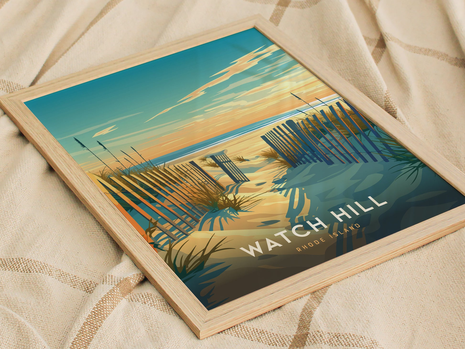 A framed poster of Watch Hill, Rhode Island, showcases a serene beach scene with sand dunes, a wooden fence, and a vibrant sunset sky.