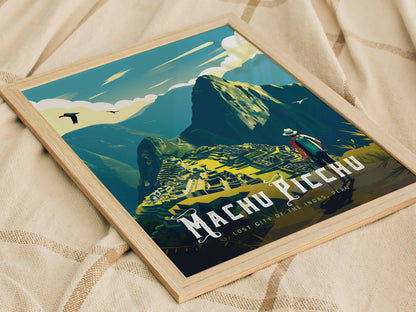 Framed artwork depicting Machu Picchu with stylized mountains and a hiker, set against a sky with birds. The image rests on a textured beige fabric.