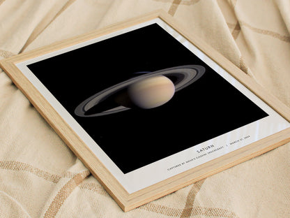 Framed print of Saturn on a textured fabric background