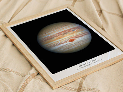 Framed print of Jupiter and Europa on a textured fabric background