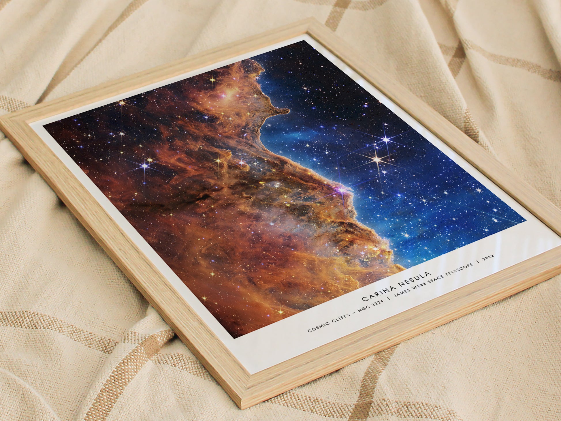 Framed James Webb Carina Nebula wall art displayed in a modern living room