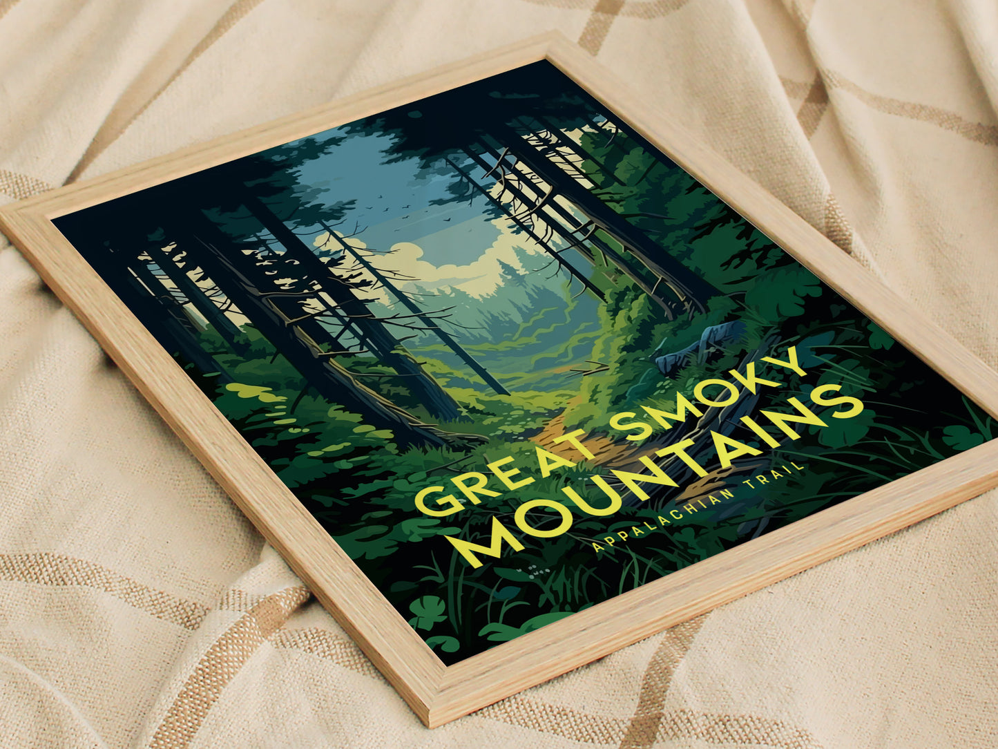 A framed poster of the Great Smoky Mountains with a forest trail design sits on a beige blanket. The text reads Great Smoky Mountains Appalachian Trail.