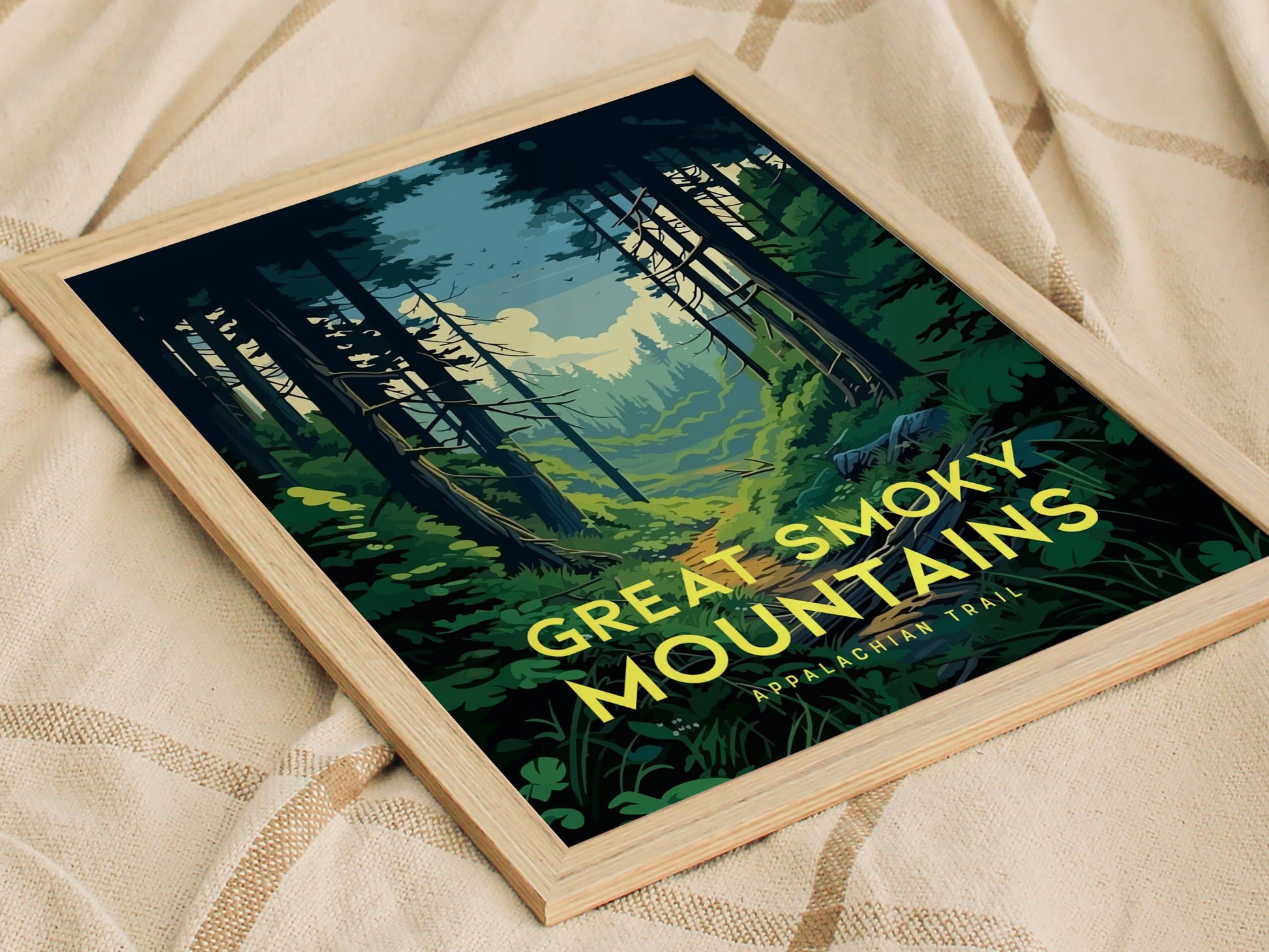 A framed poster of the Great Smoky Mountains with a forest trail design sits on a beige blanket. The text reads Great Smoky Mountains Appalachian Trail.
