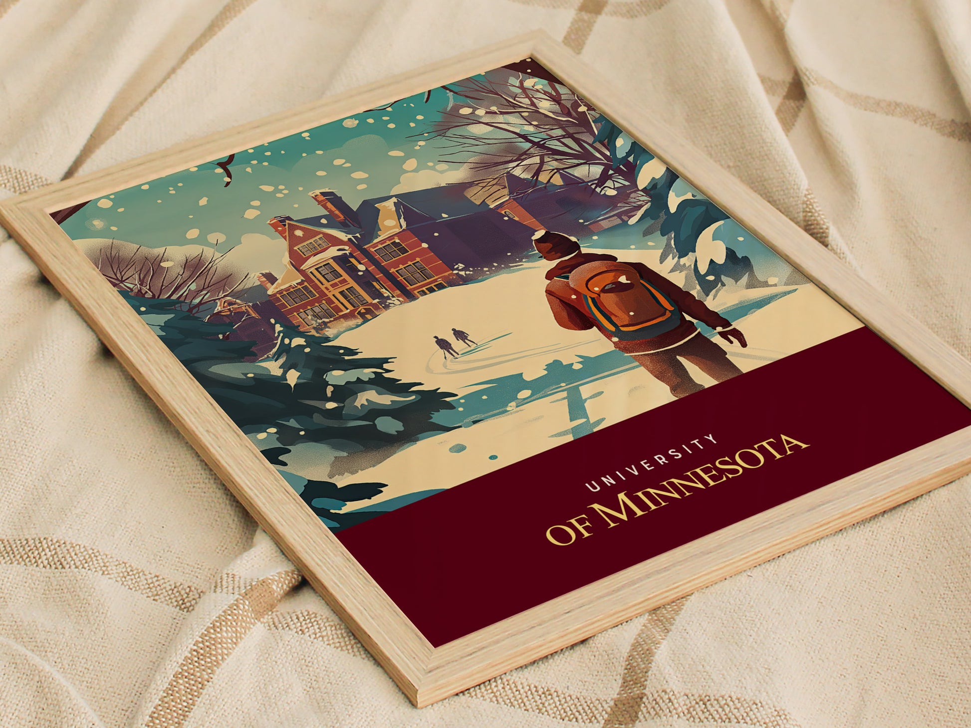 A framed poster shows a winter scene at the University of Minnesota, featuring a student with a backpack walking through snow towards a building, with trees in the background.