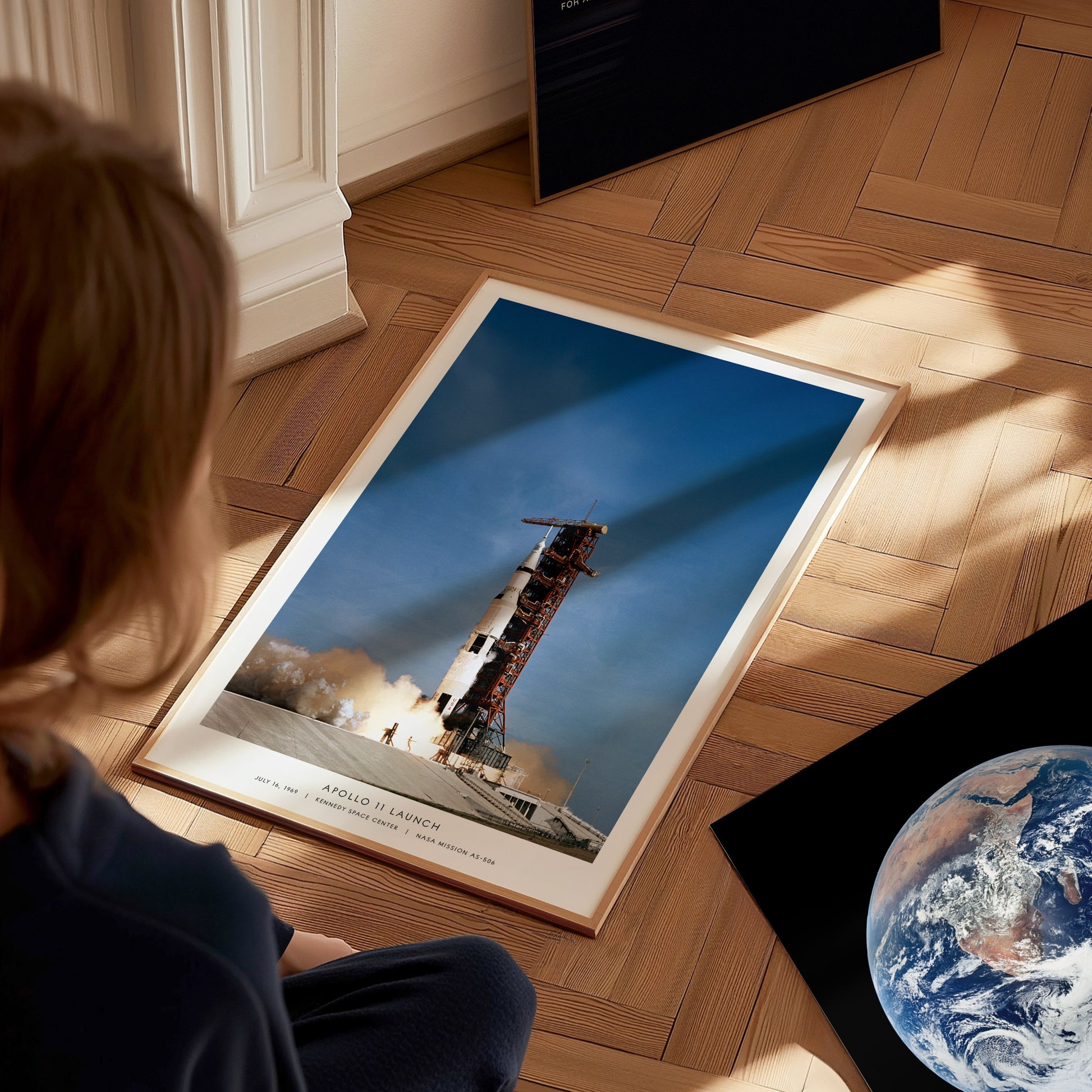 Apollo 11 launch wall art used as space themed decor in a home office or studio