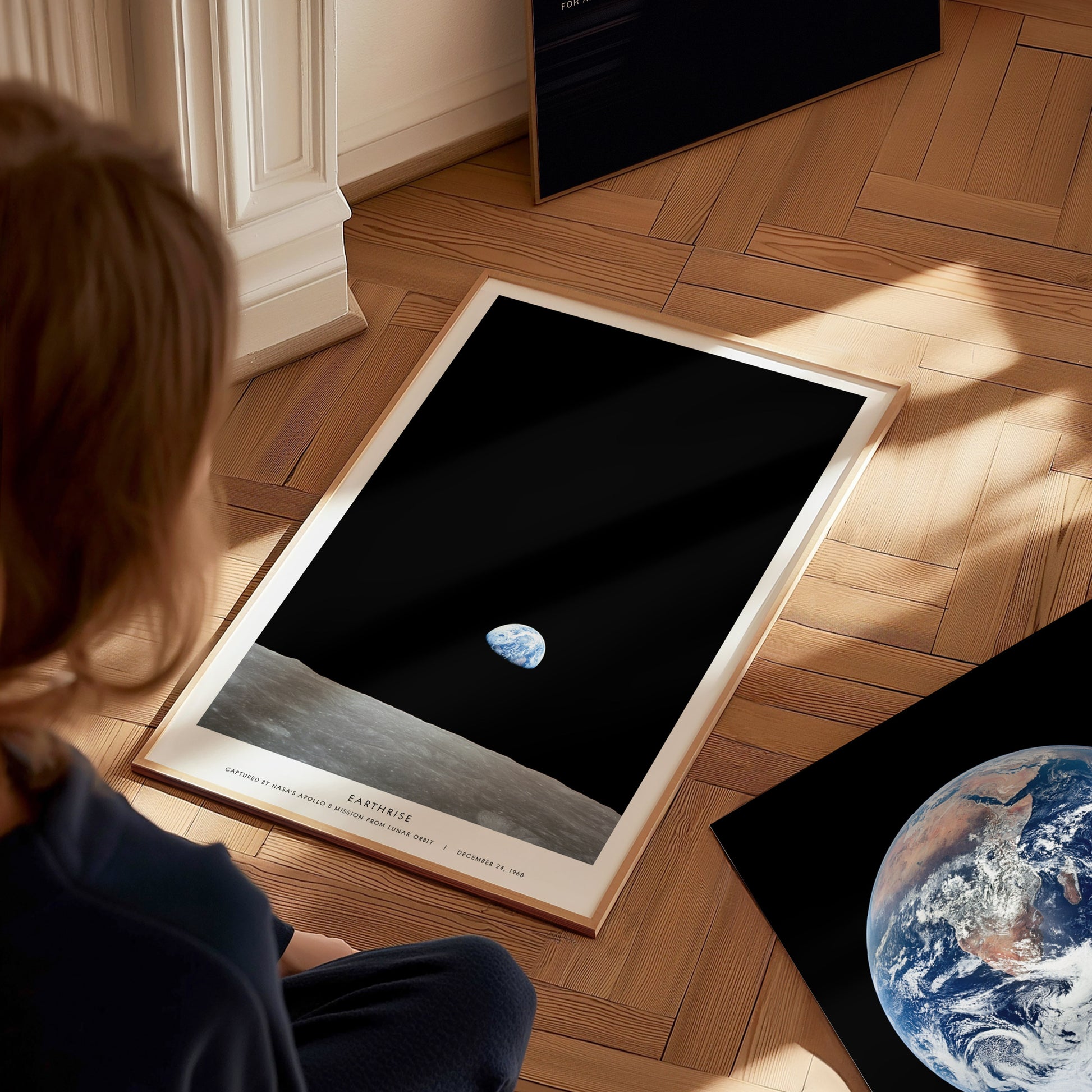 Earthrise Apollo 8 wall art used as space themed decor in a home office or studio