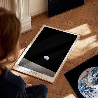 Earthrise Apollo 8 wall art used as space themed decor in a home office or studio