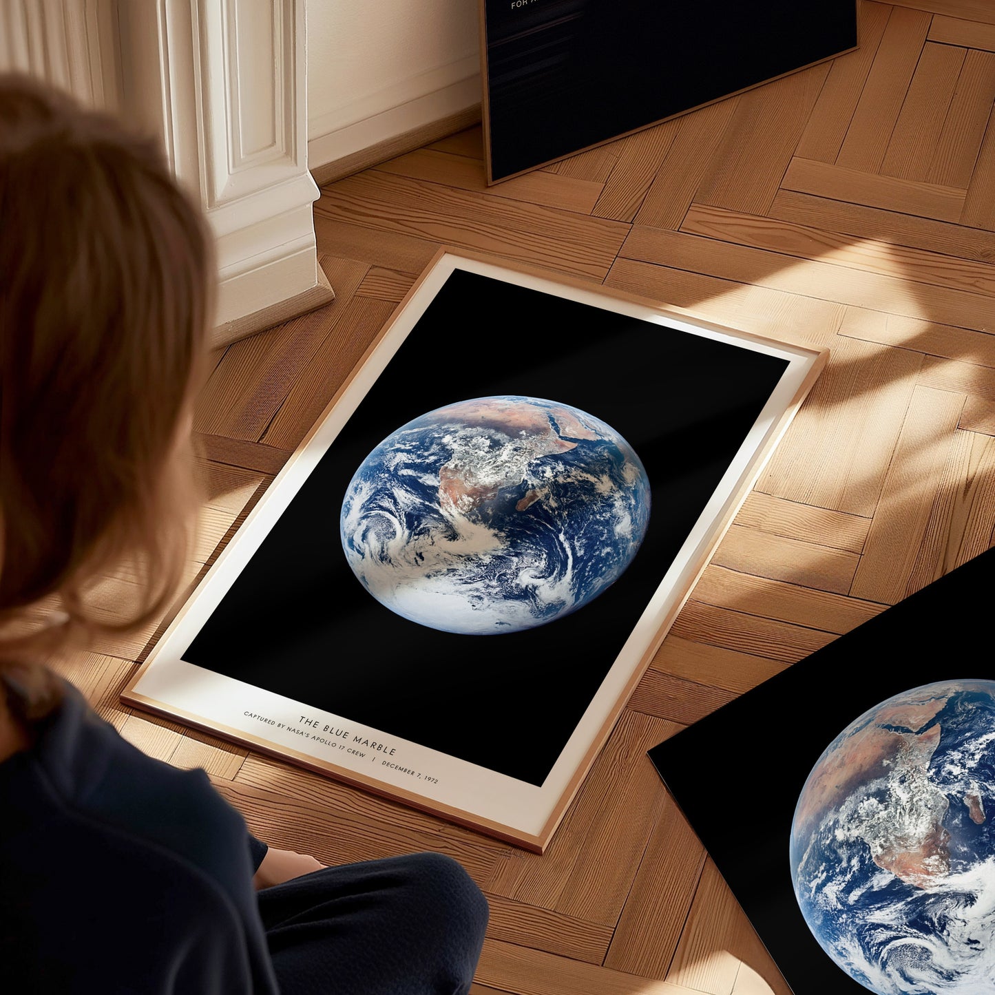 Detail of caption text on Blue Marble poster referencing Apollo 17 and the 1972 whole Earth photograph