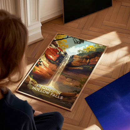 A child sits on a wooden floor, gazing at a vibrant poster depicting Hemmed-In Hollow Falls in Arkansas, featuring a waterfall cascading over colorful cliffs surrounded by lush greenery. Nearby, a starry sky print is partially visible.