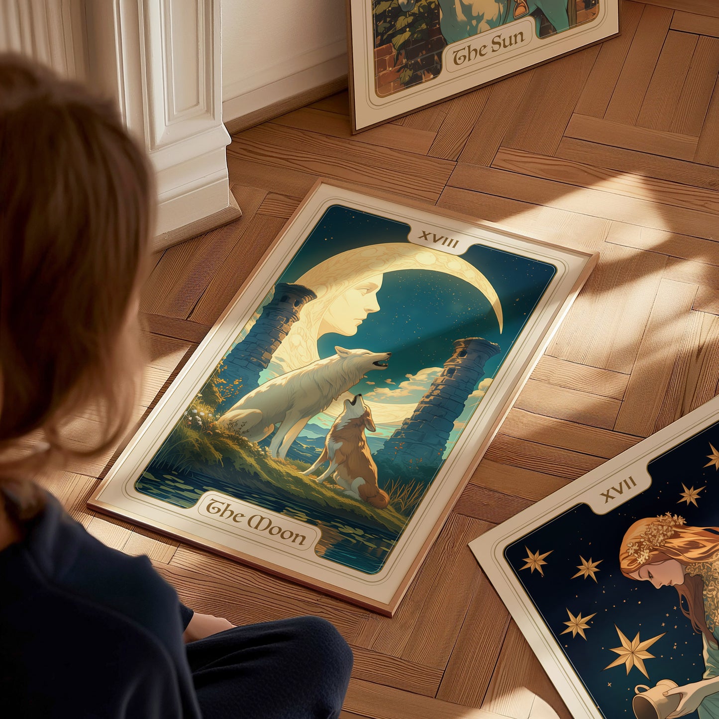 A person looks at a tarot poster depicting a crescent moon, a wolf and dog howling, with ancient pillars under a starry sky. Another tarot card is partially visible.