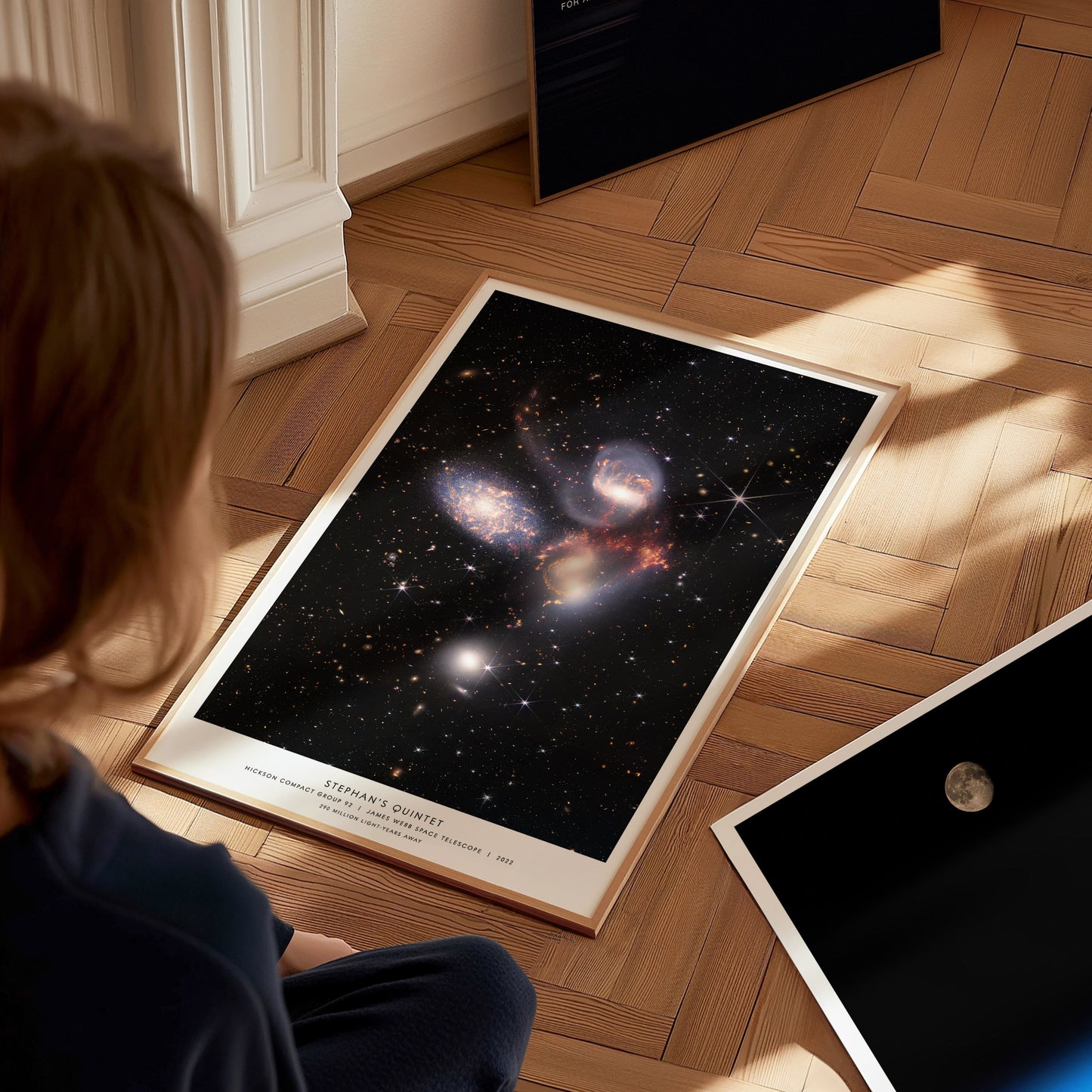 Large Stephan's Quintet James Webb poster displayed in a classroom beside STEM and astronomy posters