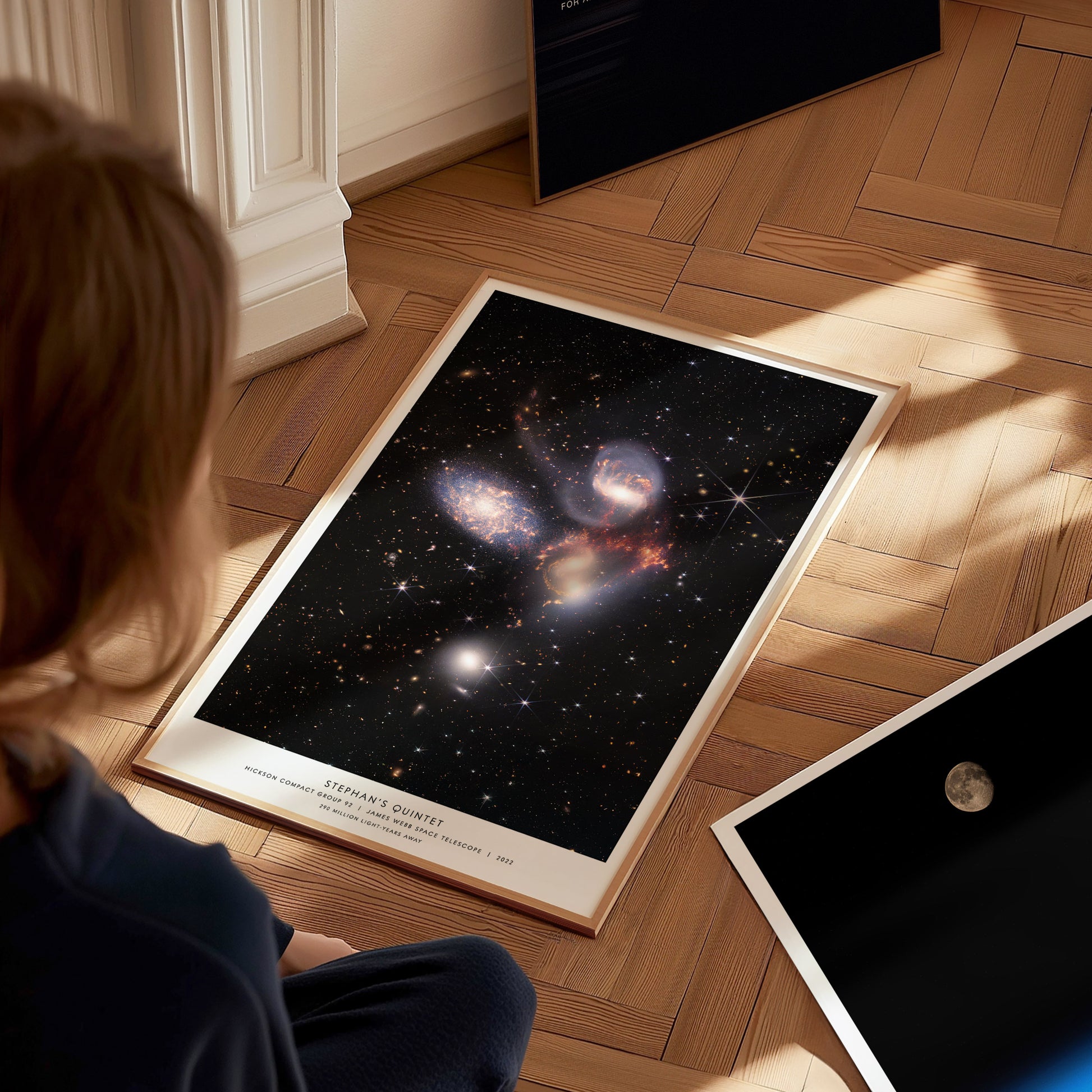 Large Stephan's Quintet James Webb poster displayed in a classroom beside STEM and astronomy posters