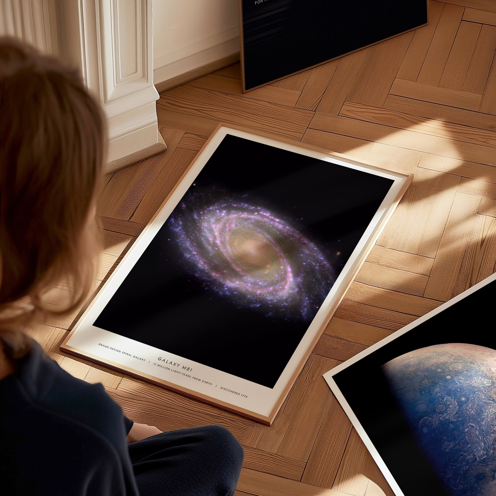 Detail of caption text on M81 galaxy poster referencing Messier 81 and spiral galaxy classification