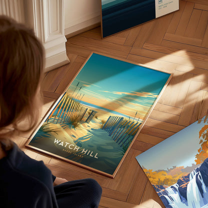 A person gazes at a vibrant Watch Hill, Rhode Island poster featuring a sandy beach path with wooden fences leading to the ocean under a colorful sky.