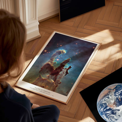 Large Pillars of Creation Hubble poster displayed in a study or classroom with science posters