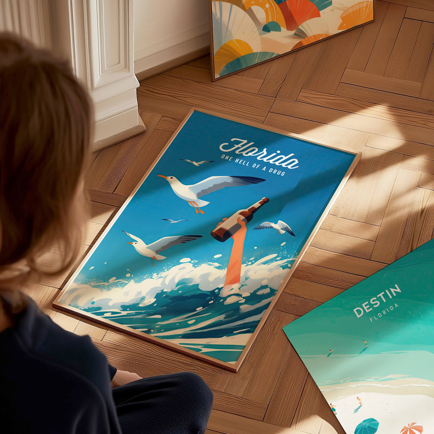 A person observes a vibrant poster depicting seagulls, a raised arm holding a bottle, and ocean waves, titled Florida: One Hell of a Drug, on a wooden floor.