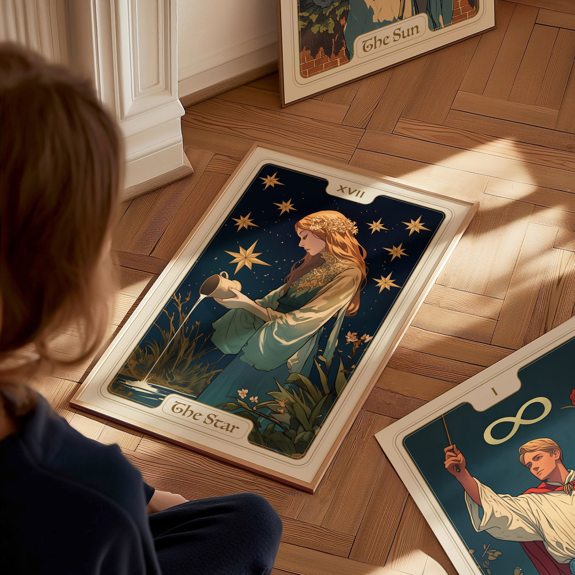 A person sits on a wooden floor, gazing at a detailed The Star tarot card illustration featuring a serene maiden pouring water under a starlit sky, labeled XVII.