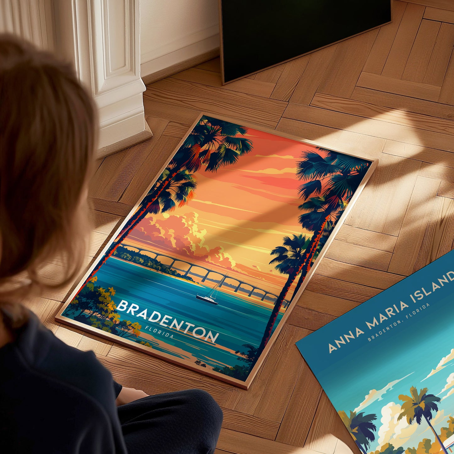 Person looking at a Bradenton, Florida-themed poster on a wooden floor.