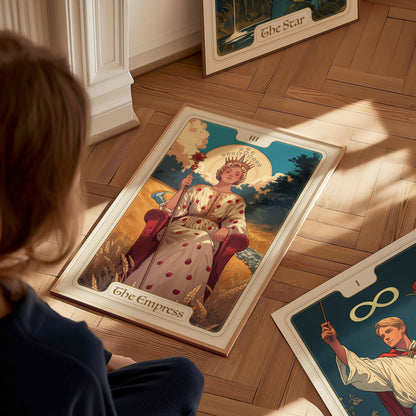 A person looks at a tarot card poster of The Empress, featuring a regal figure seated amid nature, crowned with stars and surrounded by ripe wheat.