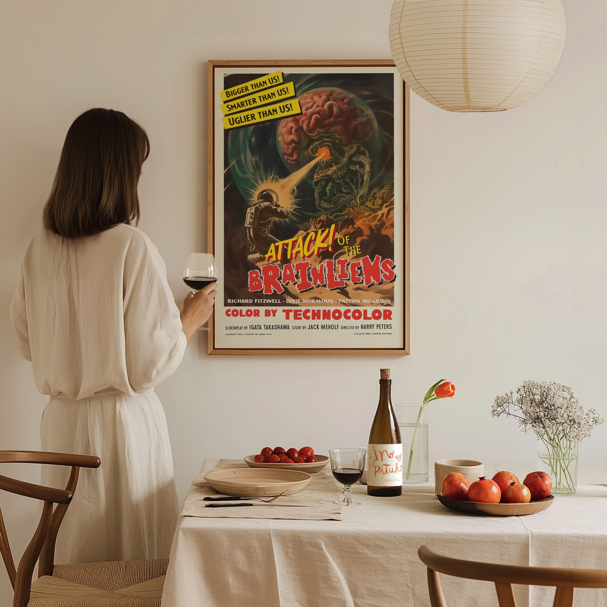 Home setting displaying framed and unframed wall art posters featuring colorful aliens and vintage sci-fi chaos.