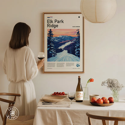 A woman in a white dress admires a framed Elk Park Ridge ski poster on a wall. A dining table is set with fruit, wine, and flowers.