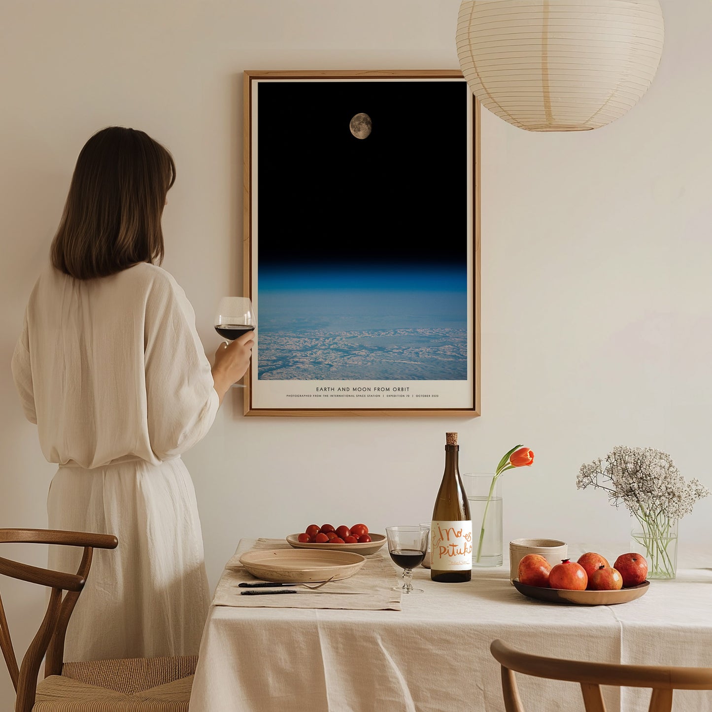 Large Earth and Moon Orbit NASA poster displayed in a home