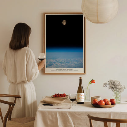 Large Earth and Moon Orbit NASA poster displayed in a home