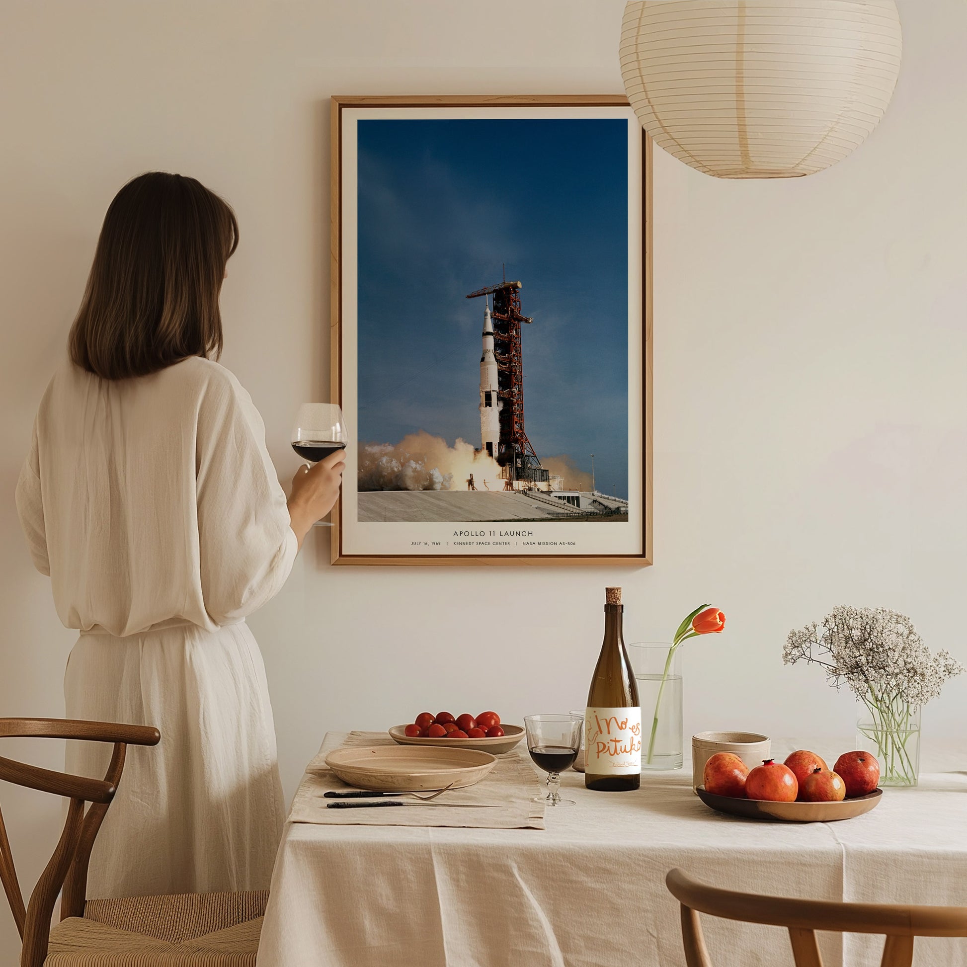 Large Apollo 11 launch NASA poster displayed in a room