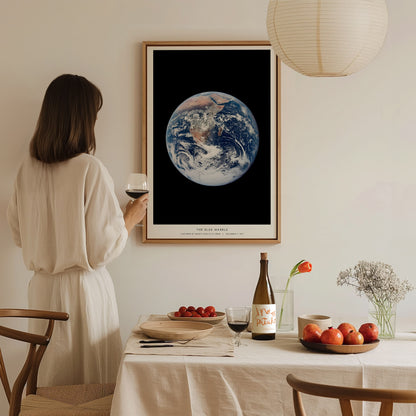 Blue Marble Earth poster in a floating frame canvas displayed on a clean white wall